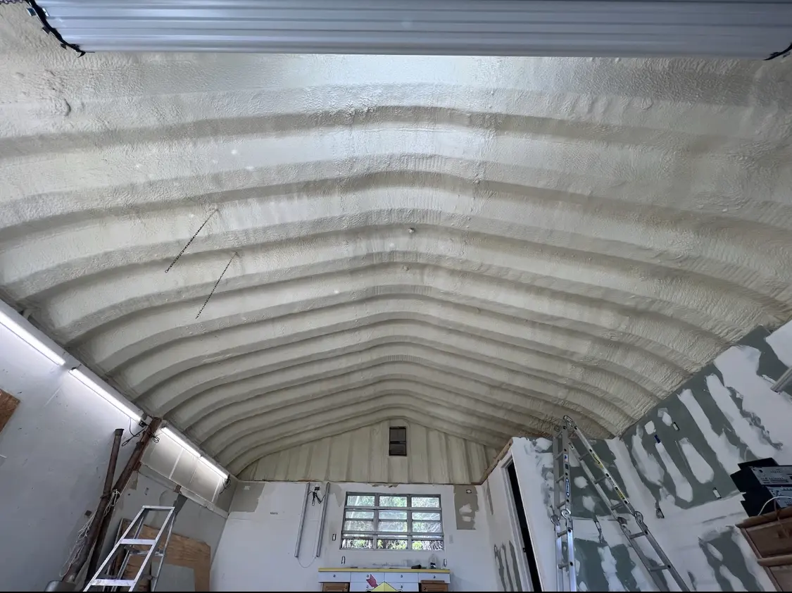 Spray polyurethane foam applied to the underside of a metal roof deck in Bristol